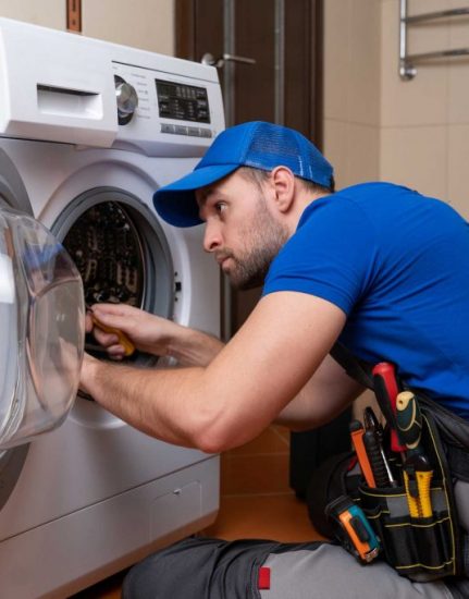 a technician repairing a washer and dryer repair charlotte